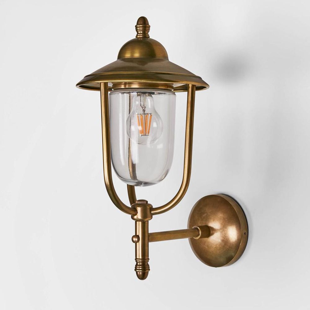 Pier Wall Lamp IP54 solid brass with clear glass and metal cage – vintage outdoor wall sconce inspired by classic gas lights for patios, entryways, and bathrooms