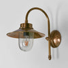 Legacy Wall Lamp IP54 solid brass with curved neck and clear glass diffuser – modern industrial outdoor wall light for hallways, stairwells, and patios