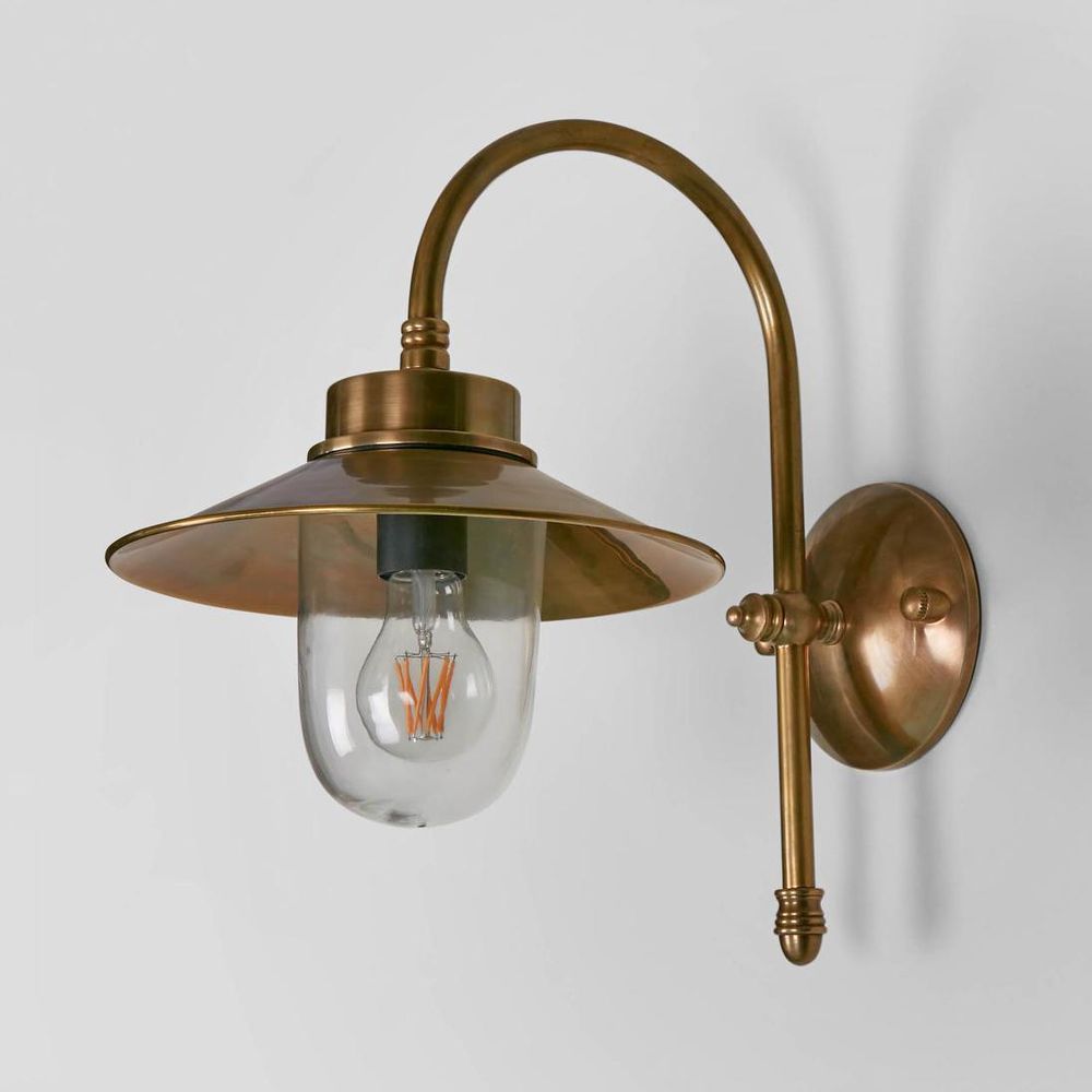 Legacy Wall Lamp IP54 solid brass with curved neck and clear glass diffuser – modern industrial outdoor wall light for hallways, stairwells, and patios