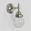 Iceberg Outdoor Wall Light antique brass with round clear glass shade – IP54 solid brass wall sconce for patios, porches, and gardens