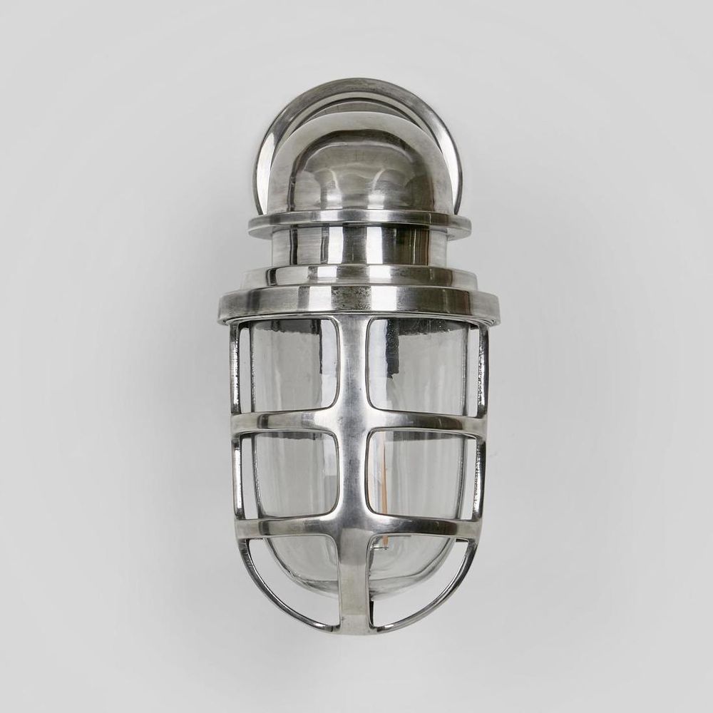 Porto Wall Light IP54 solid brass with clear glass and metal cage – industrial outdoor wall sconce for patios, entryways, and bathrooms