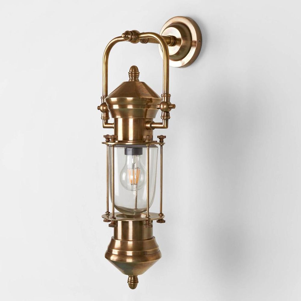 Lisbon Wall Light IP54 solid brass with clear handmade glass and metal cage – vintage outdoor wall sconce for patios, entryways, bathrooms, and industrial interiors