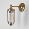 Noosa Wall Light IP54 solid brass with clear glass and brass cage – industrial outdoor wall sconce for patios, entryways, and bathrooms