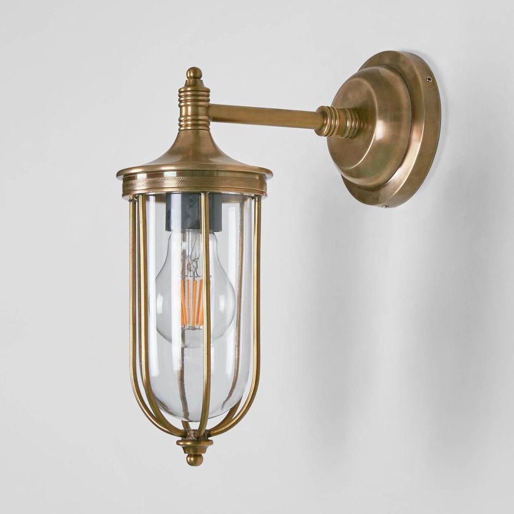 Noosa Wall Light IP54 solid brass with clear glass and brass cage – industrial outdoor wall sconce for patios, entryways, and bathrooms