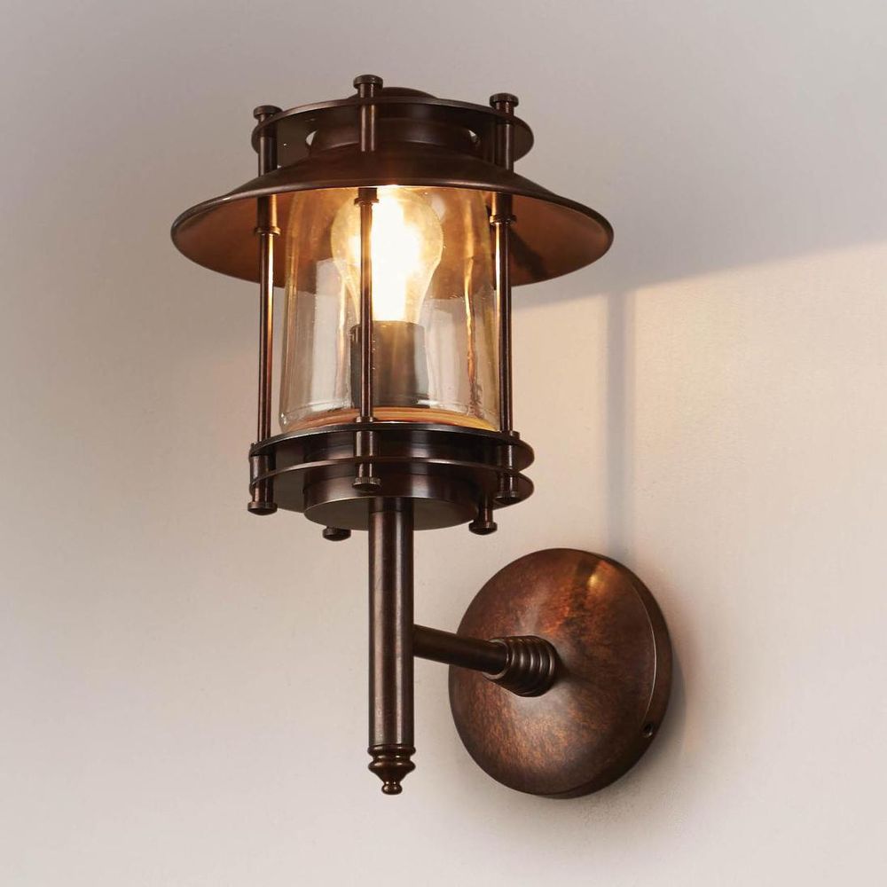 Turner Wall Light IP54 solid brass with clear glass and metal cage – industrial outdoor wall sconce for patios, entryways, and bathrooms