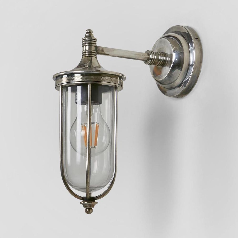 Noosa Wall Light IP54 solid brass with clear glass and brass cage – industrial outdoor wall sconce for patios, entryways, and bathrooms