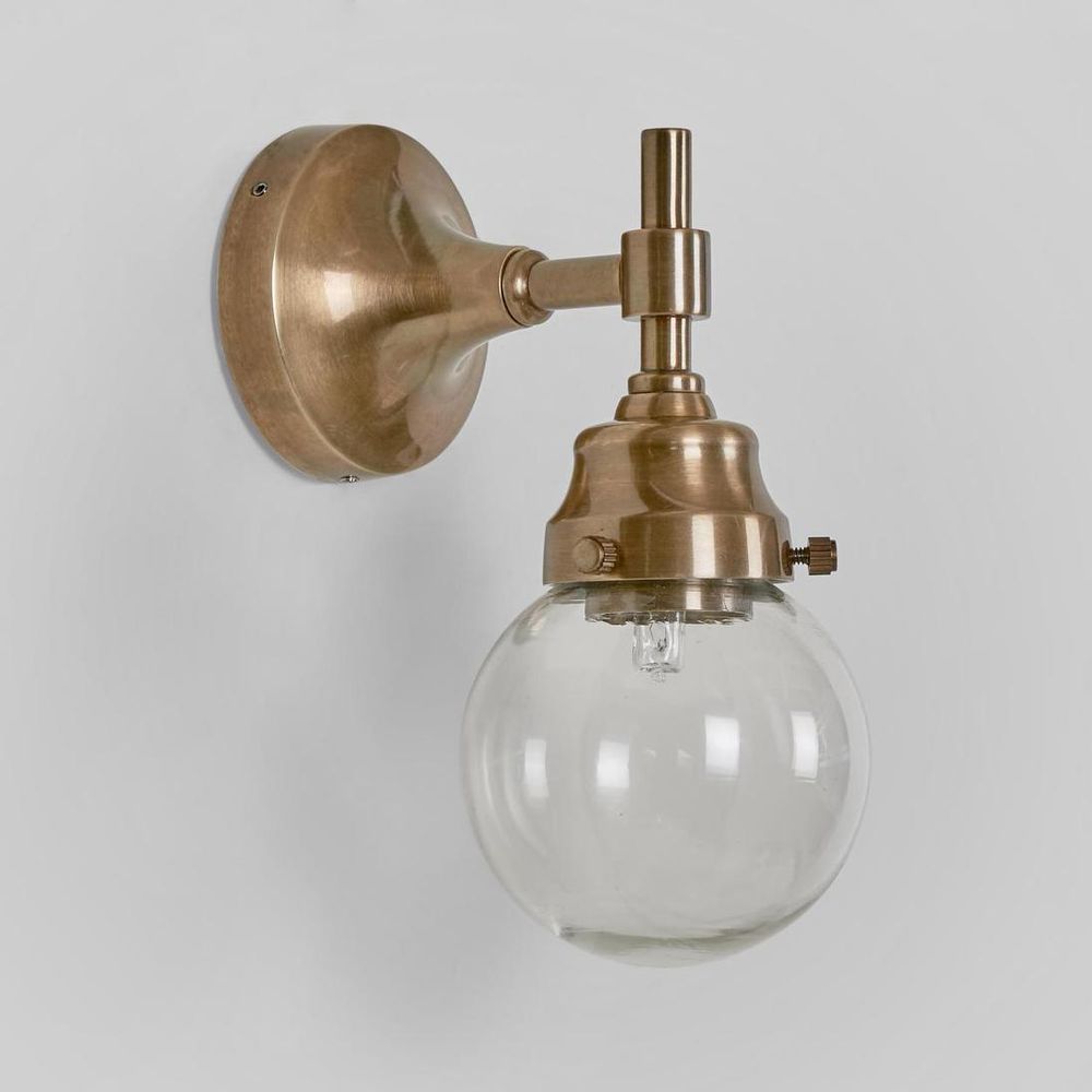 Iceberg Outdoor Wall Light antique brass with round clear glass shade – IP54 solid brass wall sconce for patios, porches, and gardens