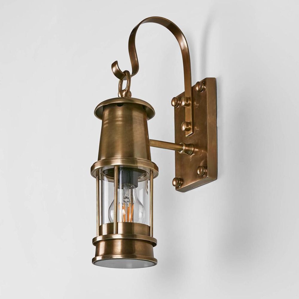 Liberty Wall Light IP54 solid brass with clear glass and brass cage – vintage industrial outdoor wall sconce for patios, entryways, and bathrooms