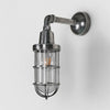 Starboard Wall Light IP54 solid brass with clear glass and metal cage – industrial outdoor wall sconce for gardens, patios, entryways, and bathroom lighting